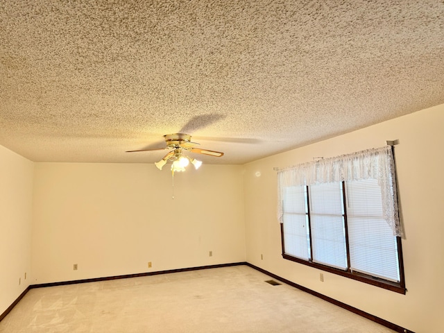 5435 State Highway 14, Sparta, MO 65753 - empty room featuring light carpet, a ceiling fan, and a textured ceiling