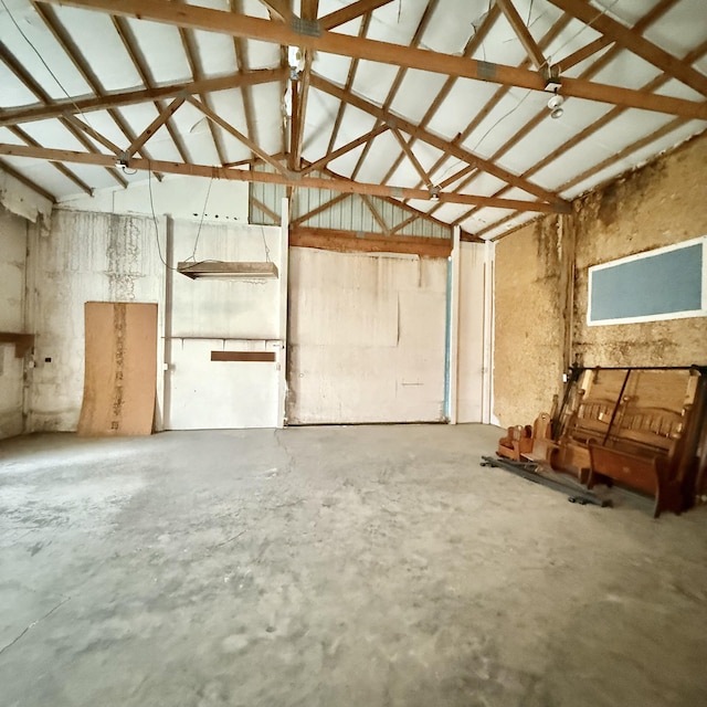 5435 State Highway 14, Sparta, MO 65753 - misc room featuring unfinished concrete floors, a garage, and high vaulted ceiling