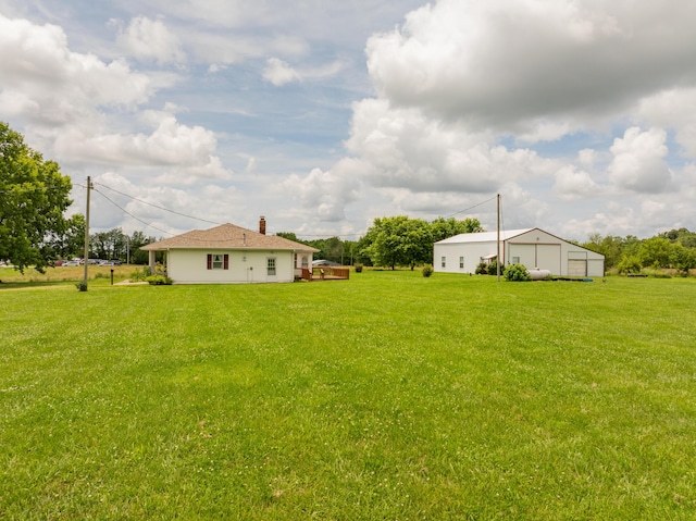 5435 State Highway 14, Sparta, MO 65753 - view of green lawn featuring a garage