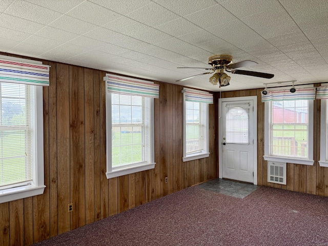 5435 State Highway 14, Sparta, MO 65753 - carpeted foyer featuring wooden walls and ceiling fan