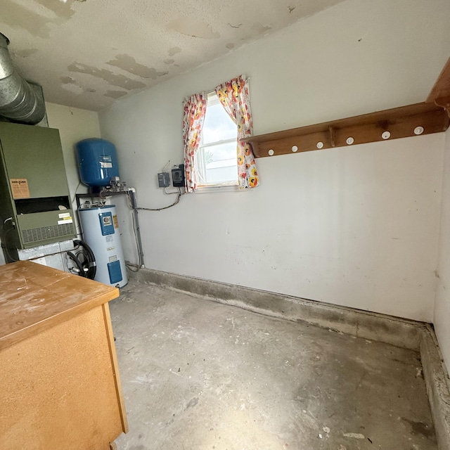 5435 State Highway 14, Sparta, MO 65753 - basement featuring electric water heater, a water pressure tank, and heating unit