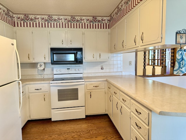 5435 State Highway 14, Sparta, MO 65753 - kitchen featuring white appliances, light countertops, and a peninsula