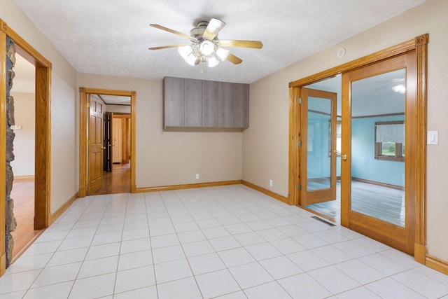3047 S Ferguson Ave, Springfield, MO 65807 - spare room featuring french doors, ceiling fan, and a textured ceiling