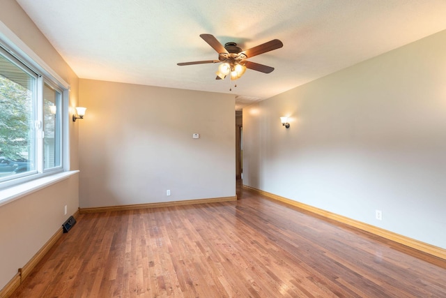3047 S Ferguson Ave, Springfield, MO 65807 - spare room featuring wood finished floors and ceiling fan