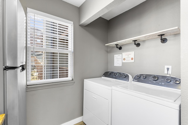 laundry room with washer and clothes dryer