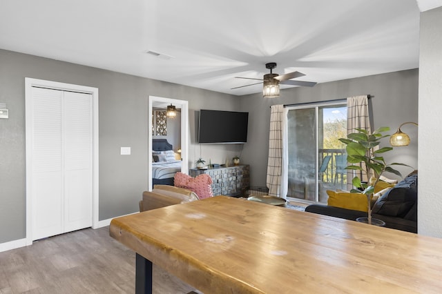 office area with wood finished floors and a ceiling fan
