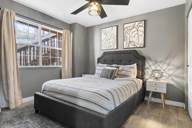 bedroom featuring wood finished floors and ceiling fan