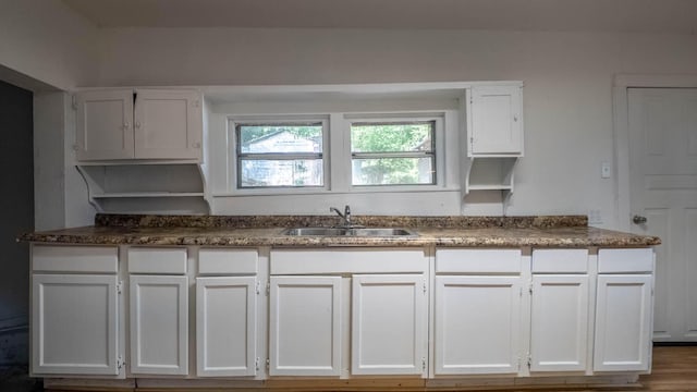 220 S 3rd St, Thayer, MO 65791 - kitchen featuring a sink and white cabinets