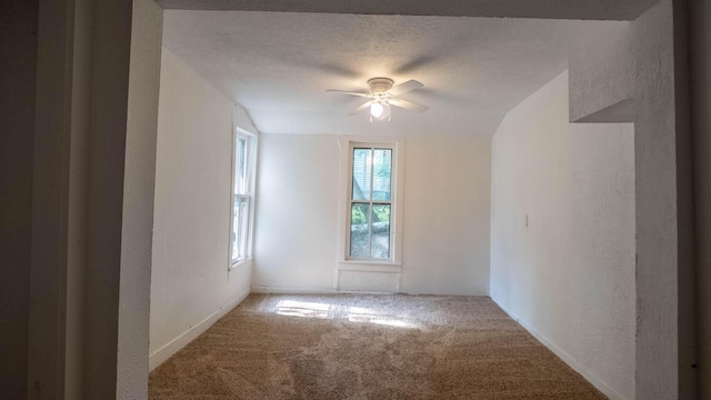 220 S 3rd St, Thayer, MO 65791 - empty room featuring a textured wall, carpet flooring, and a ceiling fan
