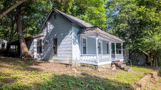 220 S 3rd St, Thayer, MO 65791 - view of side of home featuring a porch and roof with shingles