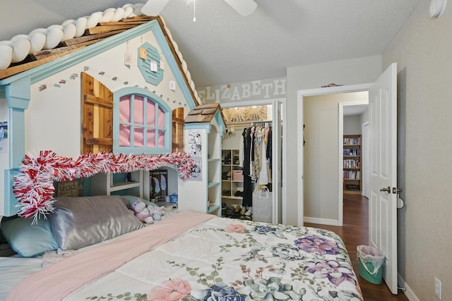 1925 Sylvan Ave, Neosho, MO 64850 - bedroom with wood finished floors, a closet, a walk in closet, and a ceiling fan