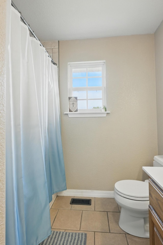 1925 Sylvan Ave, Neosho, MO 64850 - bathroom featuring vanity, tile patterned floors, and a shower with curtain
