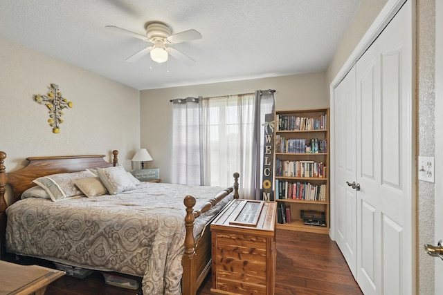 1925 Sylvan Ave, Neosho, MO 64850 - bedroom with dark wood-style floors, a closet, a textured ceiling, and a ceiling fan