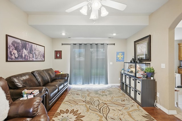 1925 Sylvan Ave, Neosho, MO 64850 - living room with wood finished floors, arched walkways, and ceiling fan