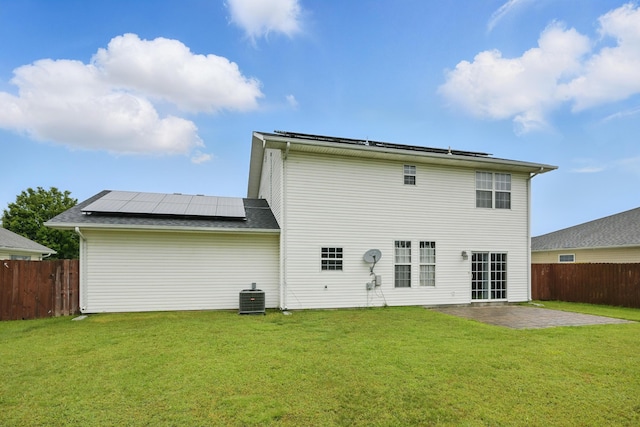 1925 Sylvan Ave, Neosho, MO 64850 - rear view of property with solar panels and a patio