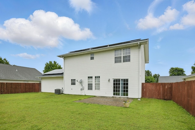 1925 Sylvan Ave, Neosho, MO 64850 - back of house featuring a fenced backyard, a patio area, and solar panels