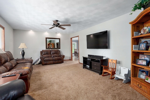 3112 E Lomita St, Springfield, MO 65804 - carpeted living area with a ceiling fan and baseboards