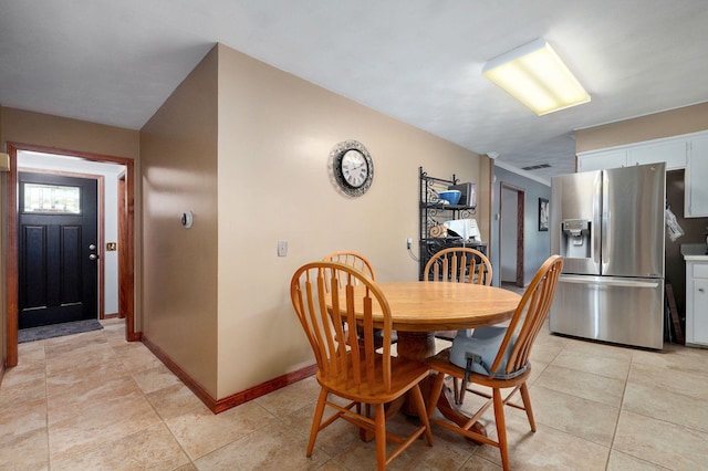 3112 E Lomita St, Springfield, MO 65804 - dining space with baseboards and light tile patterned floors