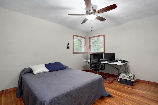 3112 E Lomita St, Springfield, MO 65804 - bedroom with wood finished floors, a ceiling fan, and a desk