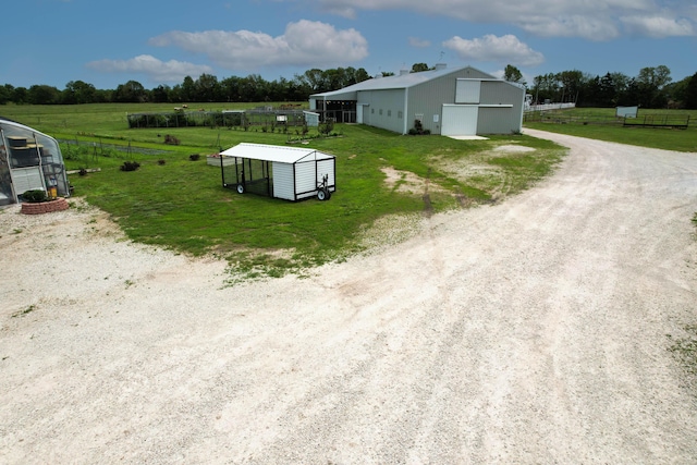 3889 E State Highway Kk, Fair Grove, MO 65648 - exterior space with an outbuilding, an outdoor structure, a rural view, and a detached garage