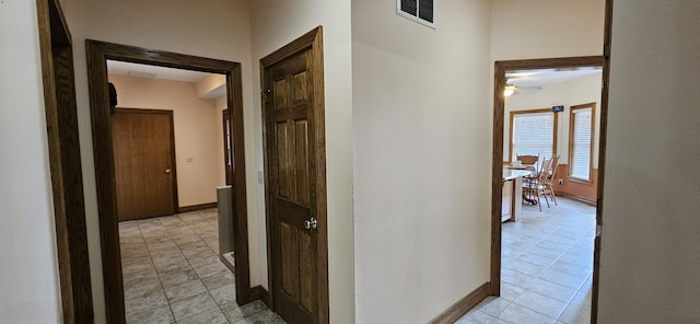3889 E State Highway Kk, Fair Grove, MO 65648 - hallway featuring light tile patterned flooring and baseboards