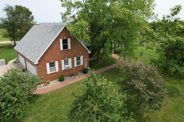 3889 E State Highway Kk, Fair Grove, MO 65648 - view of home's exterior featuring a garage, a chimney, brick siding, and roof with shingles