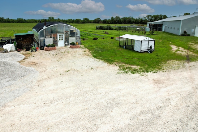 3889 E State Highway Kk, Fair Grove, MO 65648 - view of yard featuring an exterior structure, an outbuilding, and a view of rural / pastoral area
