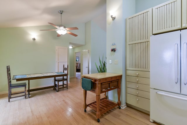 164 Sweet Home Trl, Theodosia, MO 65761 - kitchen with freestanding refrigerator, lofted ceiling, a ceiling fan, and light wood-style floors