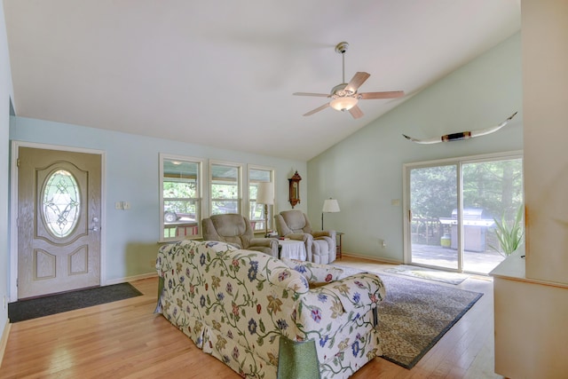 164 Sweet Home Trl, Theodosia, MO 65761 - living area with plenty of natural light, high vaulted ceiling, light wood-type flooring, and a ceiling fan