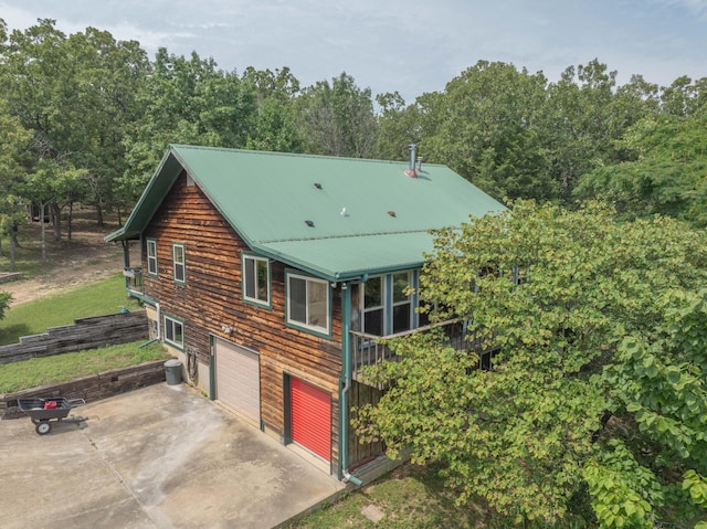 164 Sweet Home Trl, Theodosia, MO 65761 - back of house with concrete driveway and a metal roof