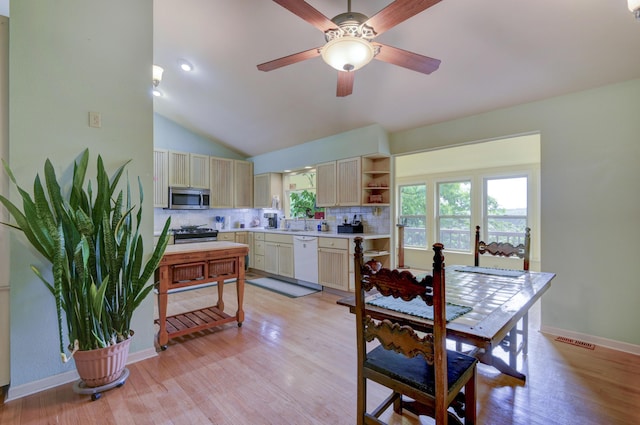 164 Sweet Home Trl, Theodosia, MO 65761 - kitchen featuring appliances with stainless steel finishes, decorative backsplash, light countertops, light wood finished floors, and vaulted ceiling