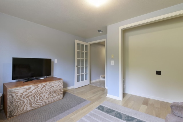 164 Sweet Home Trl, Theodosia, MO 65761 - living room with wood finished floors and french doors