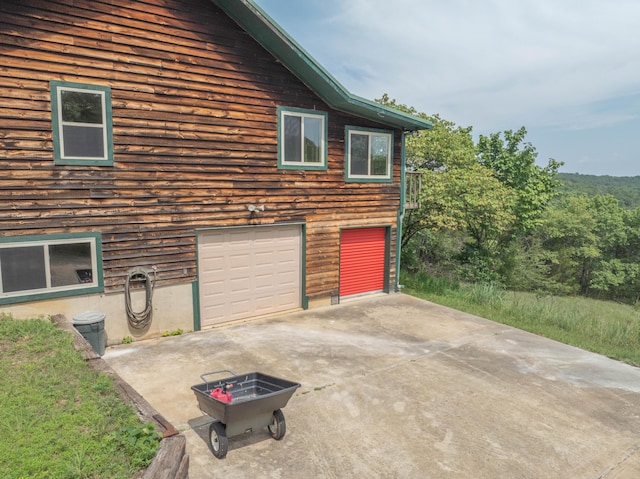 164 Sweet Home Trl, Theodosia, MO 65761 - view of property exterior with concrete driveway and an attached garage