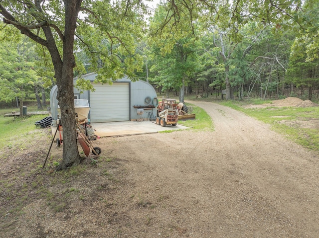 164 Sweet Home Trl, Theodosia, MO 65761 - view of yard featuring driveway, an outbuilding, and a garage