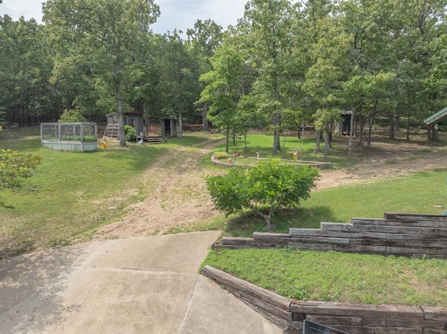164 Sweet Home Trl, Theodosia, MO 65761 - view of grassy yard featuring a garden and an outdoor structure