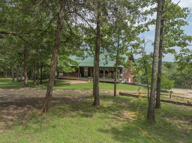 164 Sweet Home Trl, Theodosia, MO 65761 - view of green lawn with a wooden deck