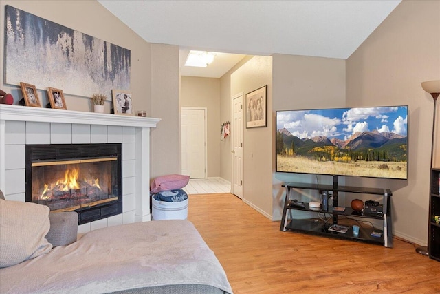 759 S Troy Ave, Springfield, MO 65802 - bedroom featuring wood finished floors and a tiled fireplace