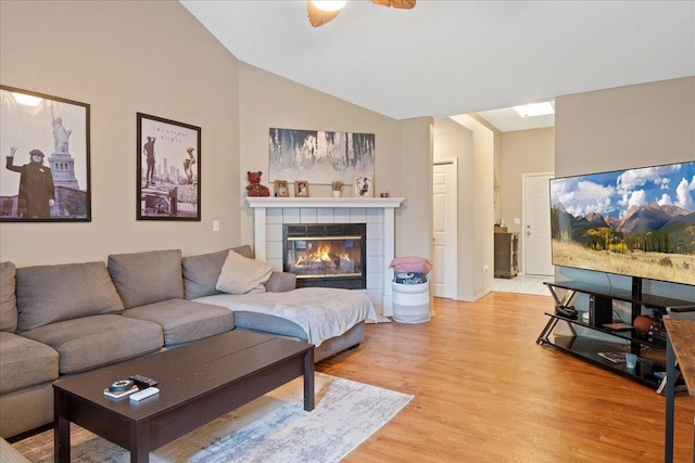 759 S Troy Ave, Springfield, MO 65802 - living room featuring light wood-style floors, vaulted ceiling, a fireplace, and ceiling fan