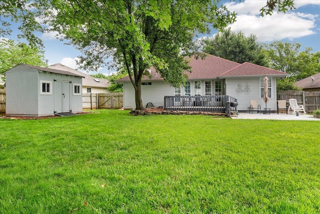 759 S Troy Ave, Springfield, MO 65802 - back of property featuring a fenced backyard, a patio, and a storage unit