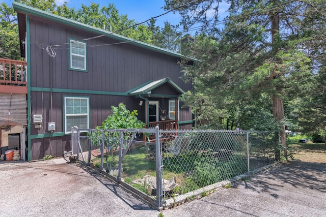 426 Lakewood Rd, Branson, MO 65616 - chalet / cabin with a fenced front yard and a chimney
