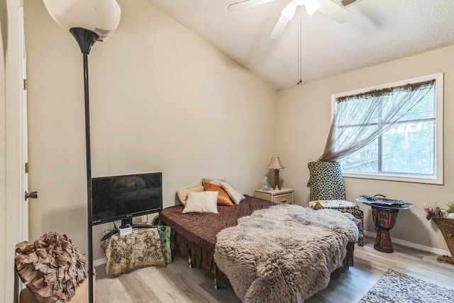 426 Lakewood Rd, Branson, MO 65616 - bedroom featuring wood finished floors, ceiling fan, and vaulted ceiling