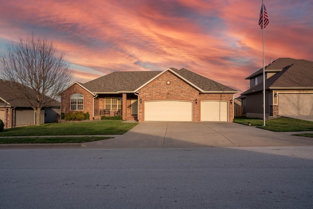 1466 S Natchez Rd, Republic, MO 65738 - view of front of property with a garage, driveway, brick siding, a lawn, and a shingled roof