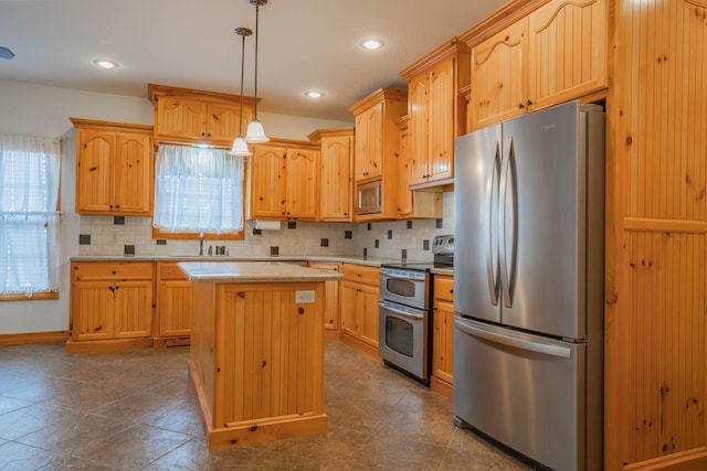 1466 S Natchez Rd, Republic, MO 65738 - kitchen with stainless steel appliances, light countertops, tasteful backsplash, a kitchen island, and light brown cabinetry