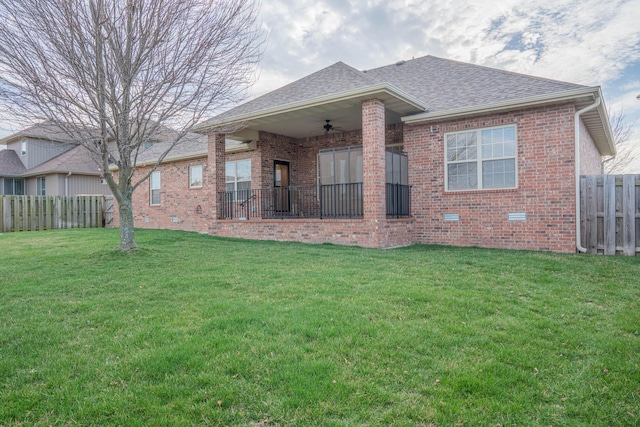 1466 S Natchez Rd, Republic, MO 65738 - back of property with a ceiling fan, brick siding, a fenced backyard, and roof with shingles