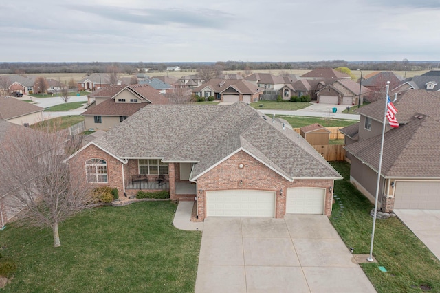 1466 S Natchez Rd, Republic, MO 65738 - view of front of house with a shingled roof, brick siding, a residential view, and driveway