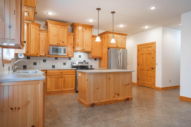 1466 S Natchez Rd, Republic, MO 65738 - kitchen featuring stainless steel appliances, light brown cabinetry, tasteful backsplash, a kitchen island, and light countertops