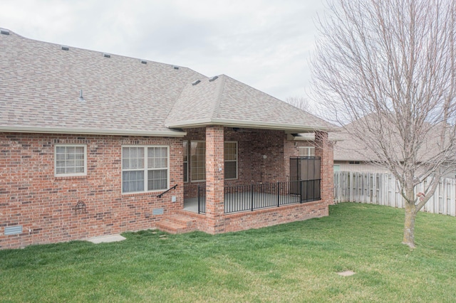 1466 S Natchez Rd, Republic, MO 65738 - rear view of house with a shingled roof, brick siding, a fenced backyard, and a patio area