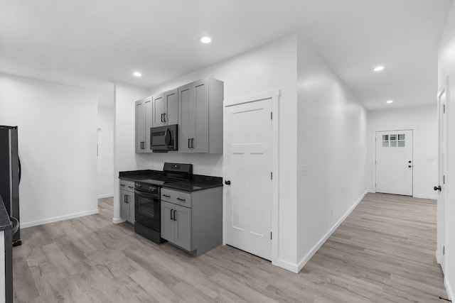 804 Iris Ave, Crane, MO 65633 - kitchen featuring black range, gray cabinetry, light wood finished floors, and recessed lighting