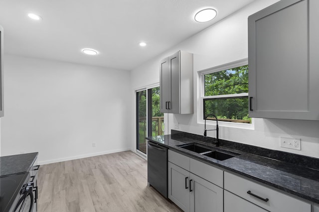 804 Iris Ave, Crane, MO 65633 - kitchen featuring dishwasher, black range, light wood finished floors, dark stone counters, and recessed lighting