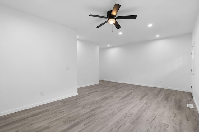 804 Iris Ave, Crane, MO 65633 - unfurnished room with light wood-style flooring, a ceiling fan, and recessed lighting